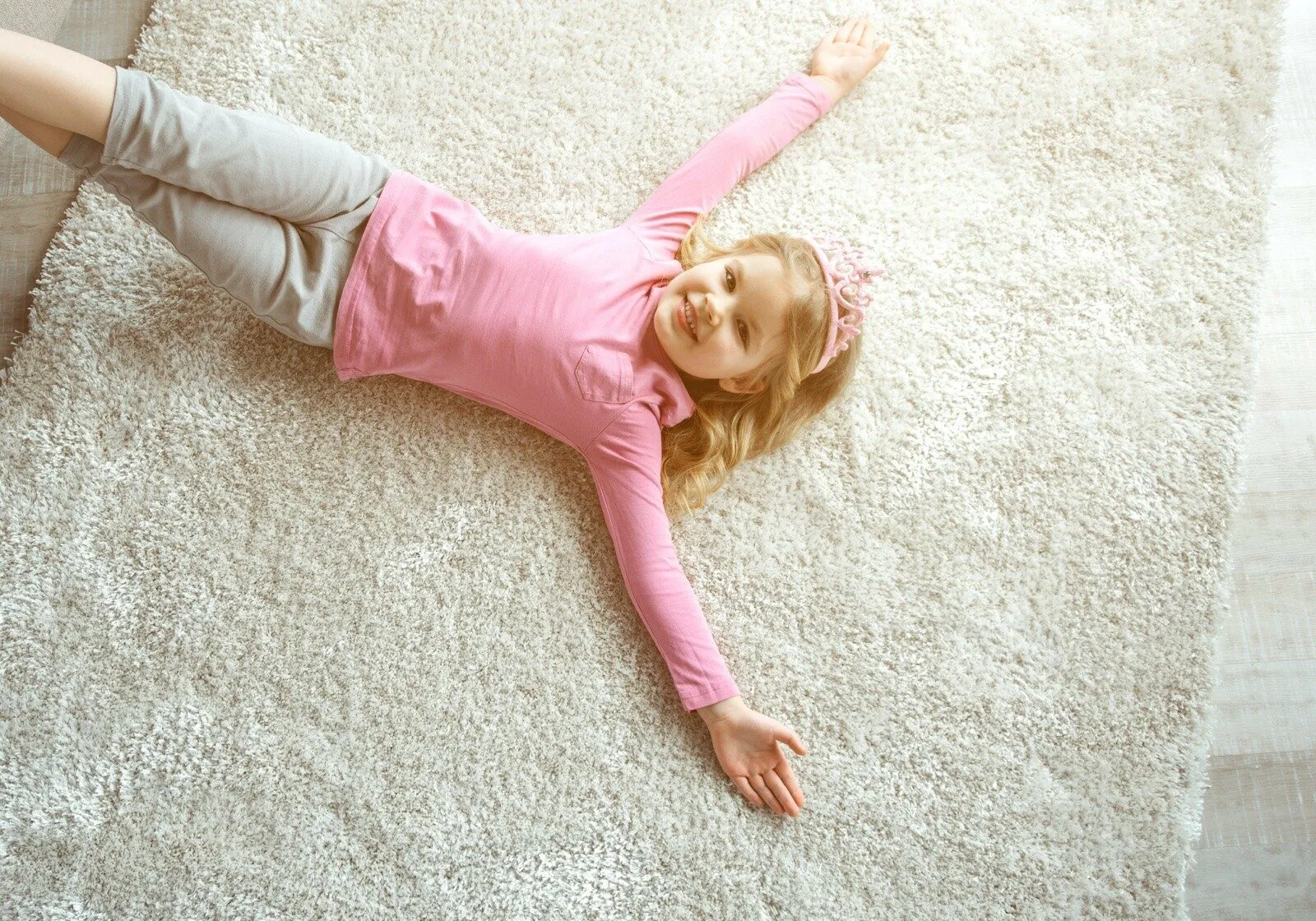 Girl laying on carpet | Staff Carpet